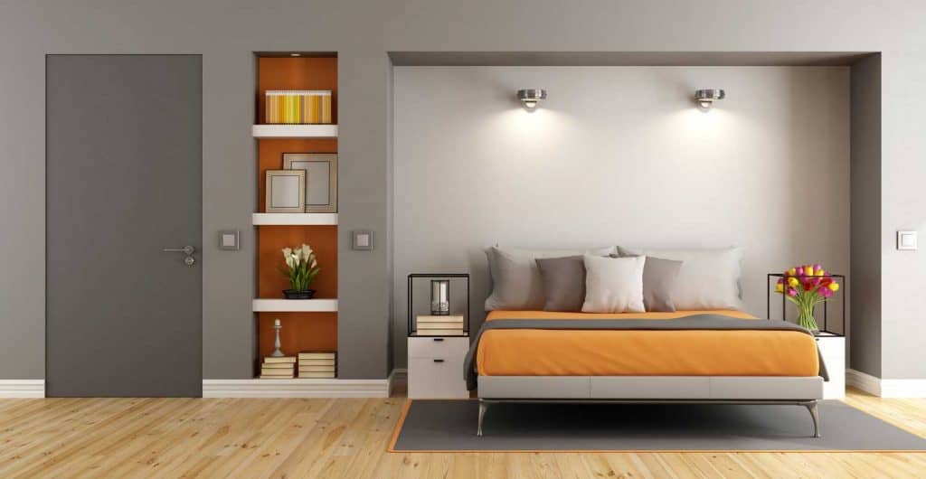 Gray inspired bedroom with orange and gray beddings