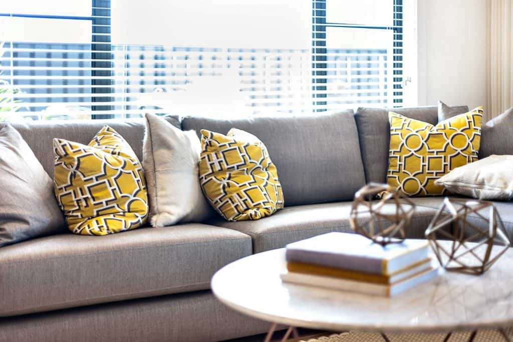Mixed Throw Pillows in a Gray Couch | | Article by HomeDecorBliss.com