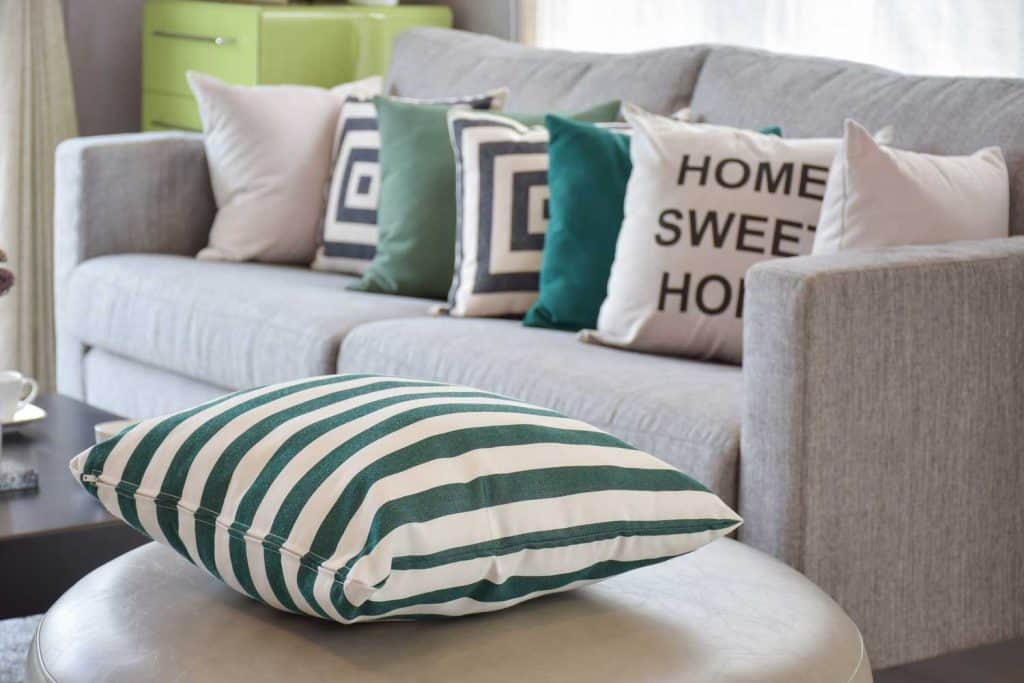 Blast of Throw Pillows in a Small Couch | Article by HomeDecorBliss.com
