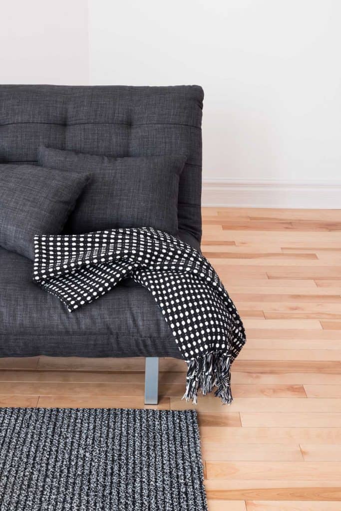 Charcoal Throw Pillow Paired with a Polka-Dot-Embelished Element | Article by HomeDecorBliss.com