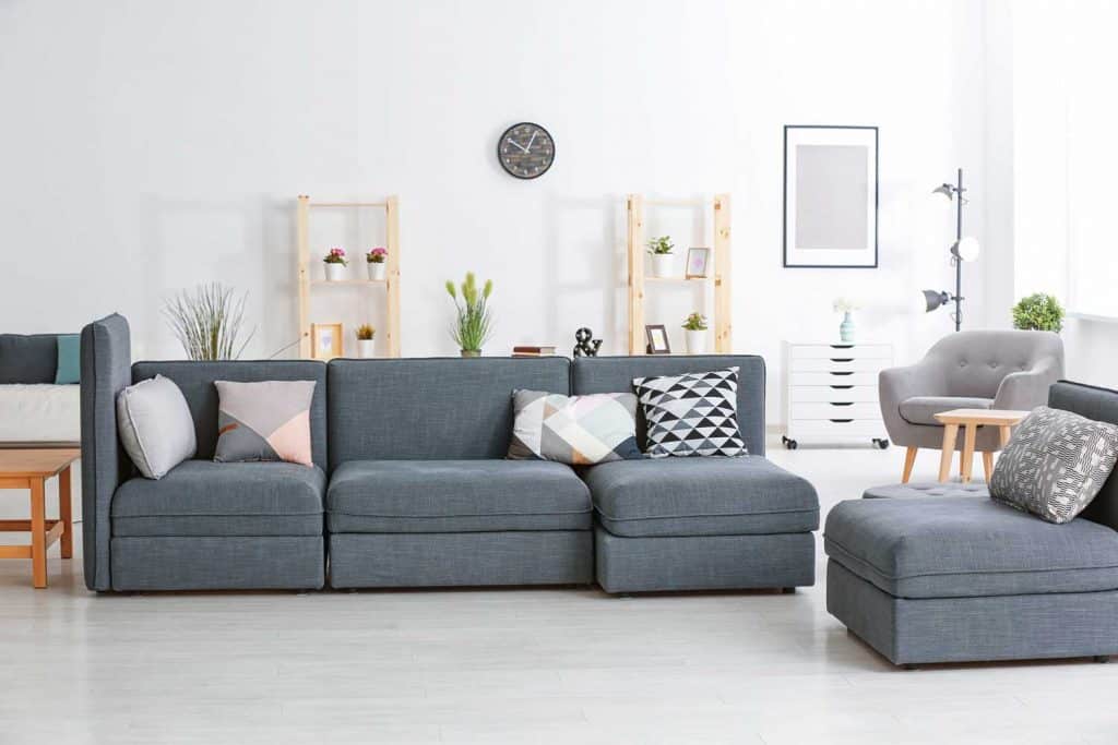 Geometric Throw Pillows on a Sectional Couch | | Article by HomeDecorBliss.com