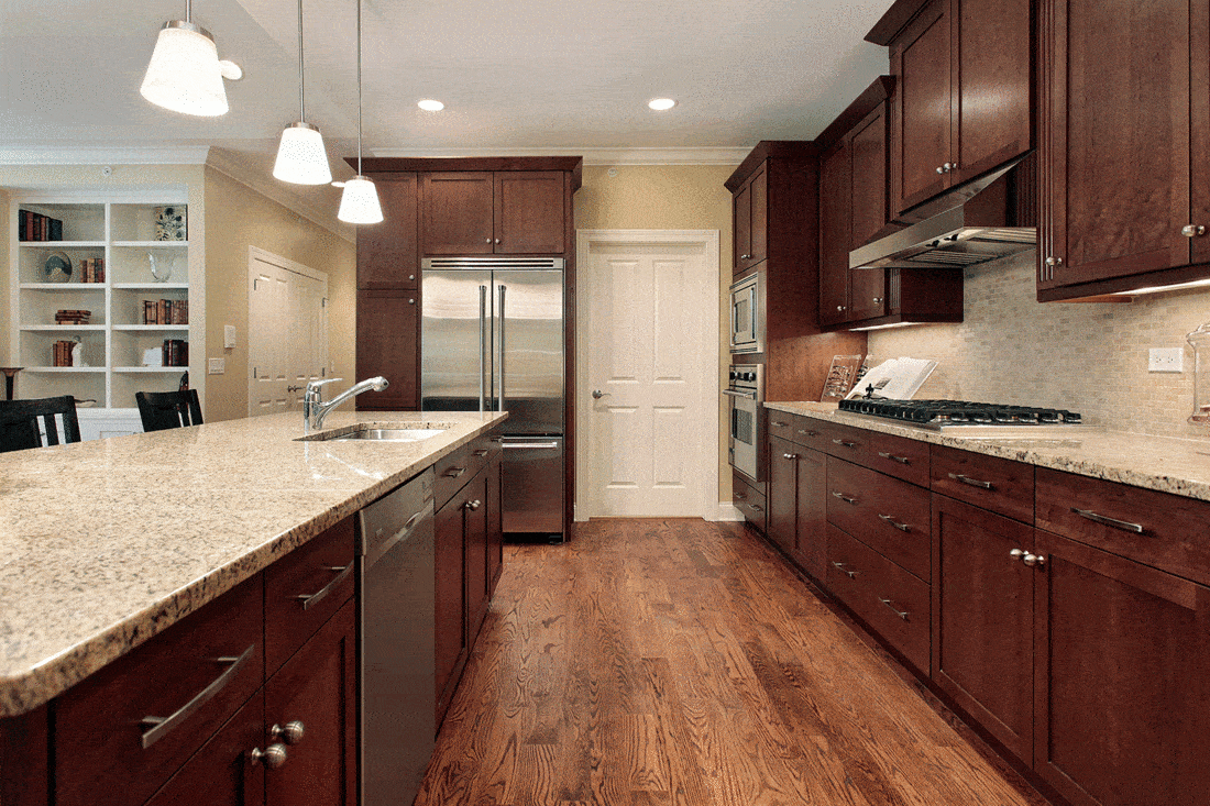 Classy kitchen with dark wood cabinets