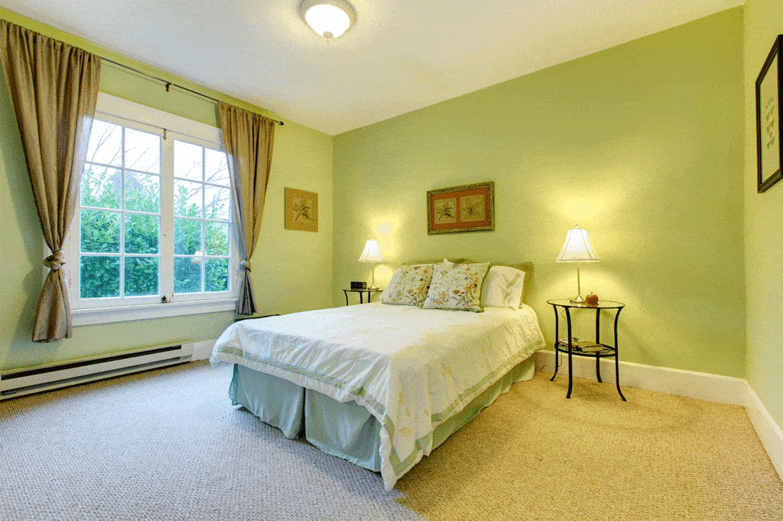 Cozy bedroom with mint wall and beige floor