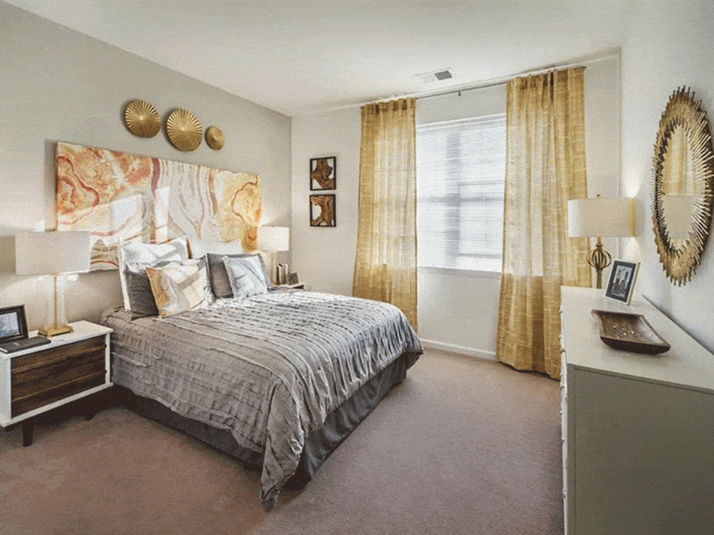 Large master bedroom with gold colored interiors