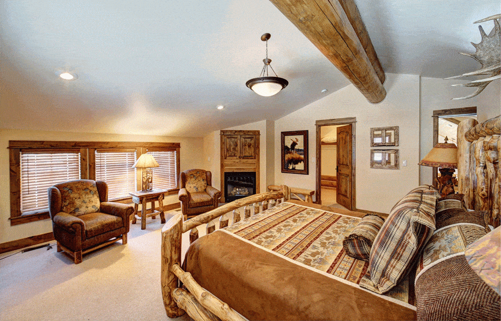 Log cabin design large master bedroom