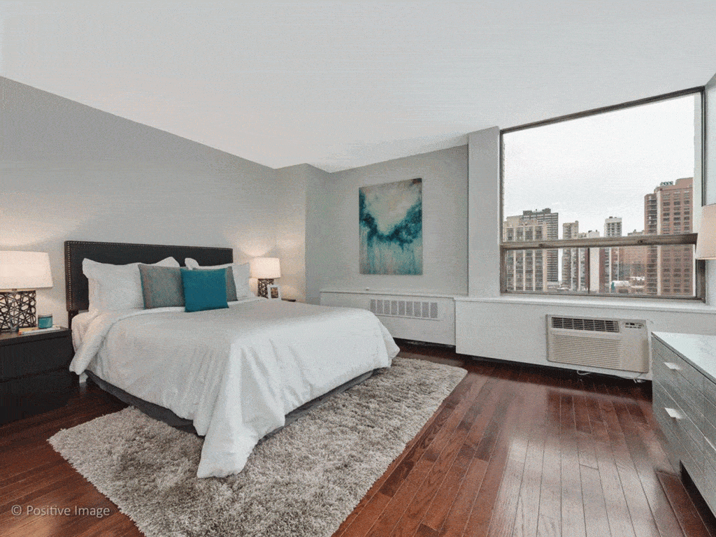Modern large master bedroom with wood carpet flooring