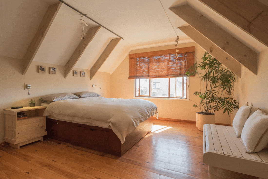 Simple attic bedroom with wood interior