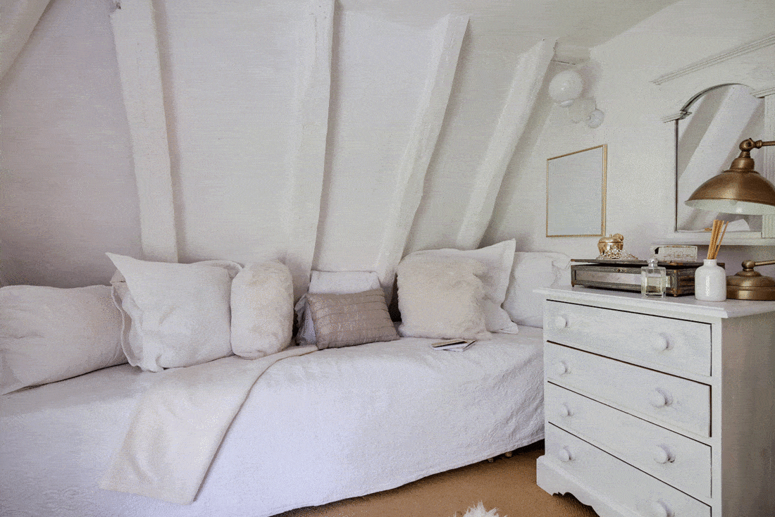 Small white attic bedroom