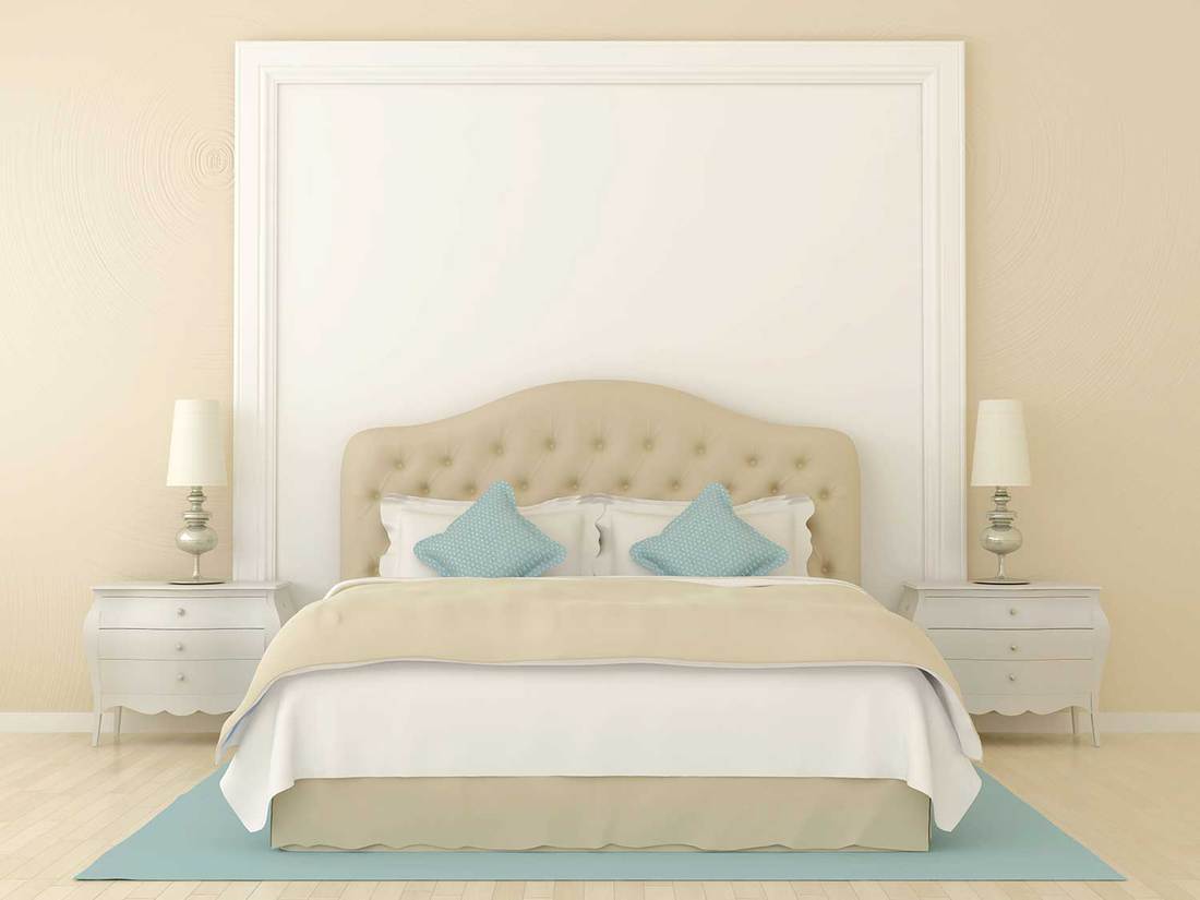 Bedroom in soft beige colors with blue decoration