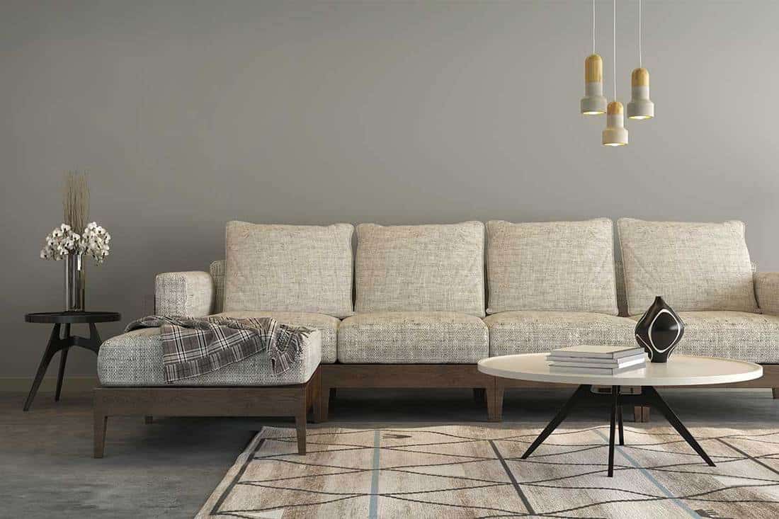 Beige sofa with a living room like setup around it