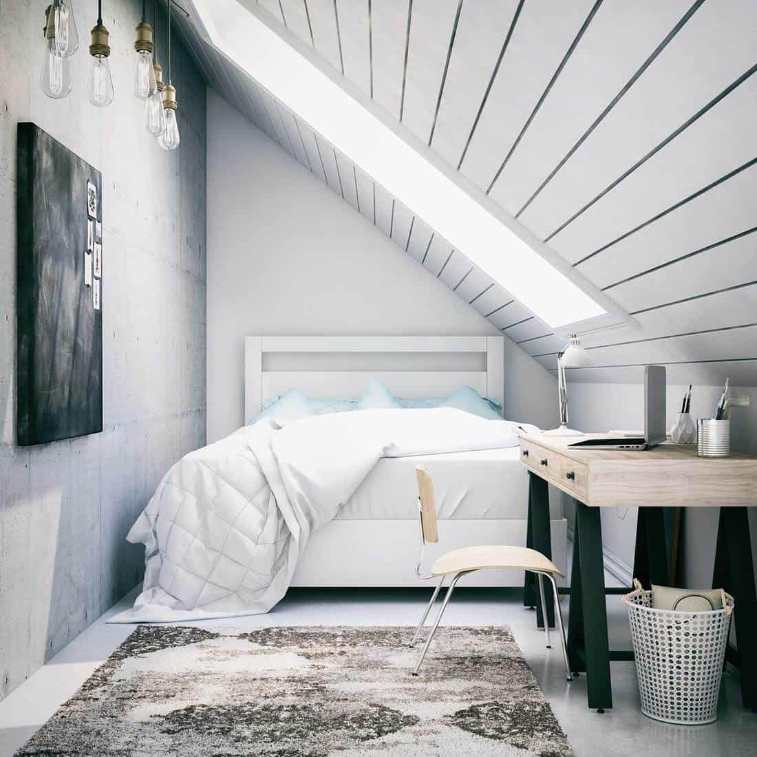 Black and white attic bedroom with abstract design area rug