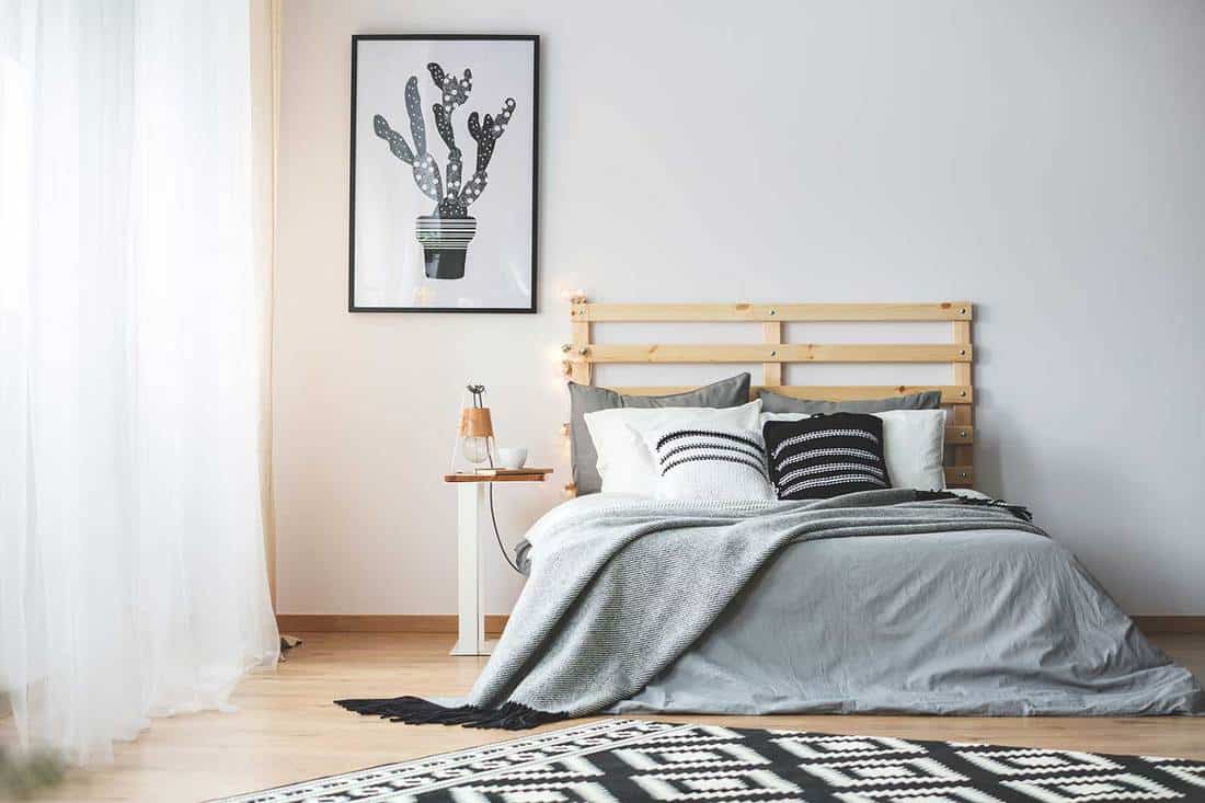 Black and white bedroom with patterned carpet