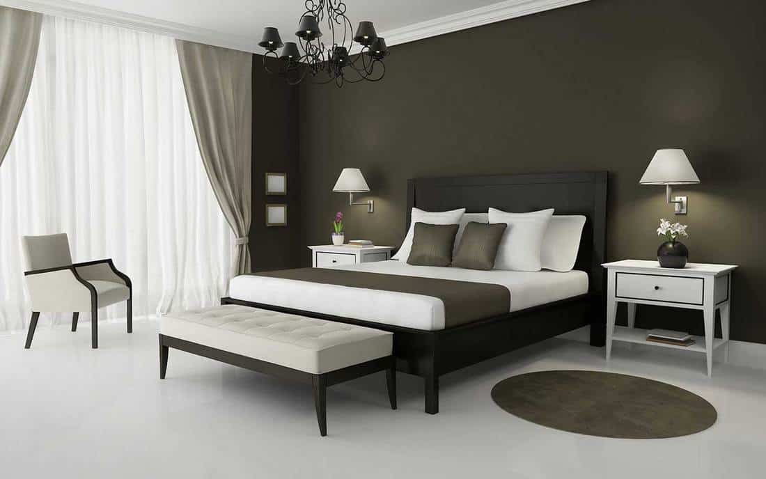 Interior of modern bedroom with olive green walls
