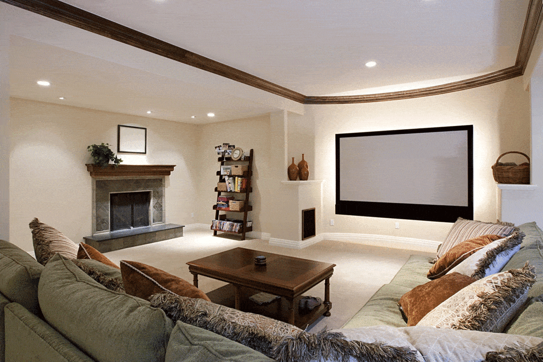 Modern rustic basement living room with wide screen tv and fireplace