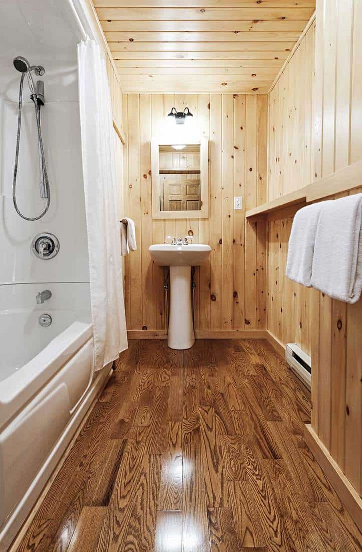 Washroom interior with pine wood wall planking