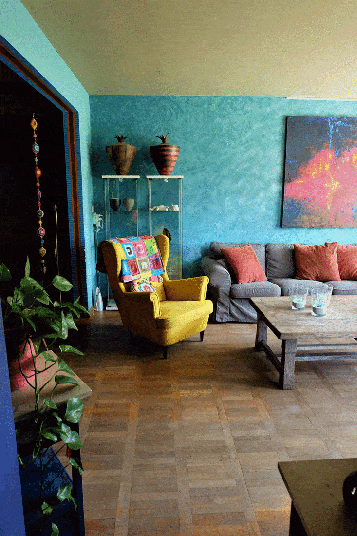 Yellow single sofa in a boho style living room