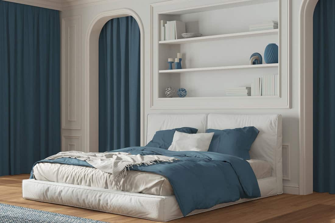 Classic bedroom in white and blue tones. 