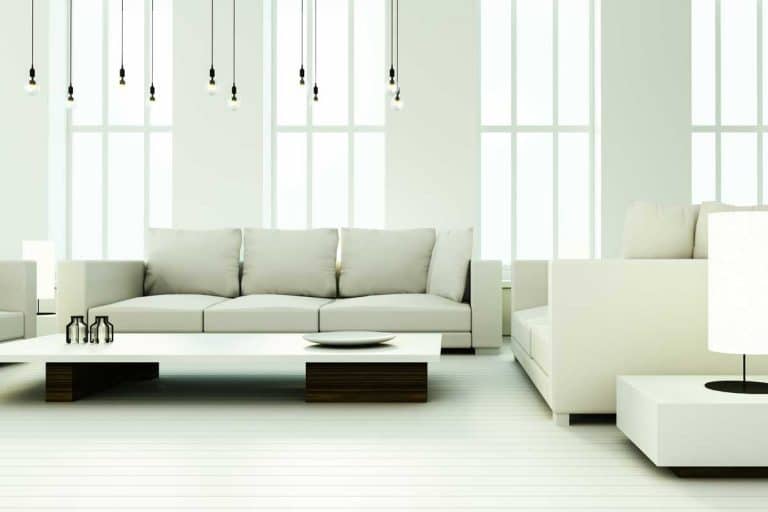 Cozy white living room interior with sofa set and wooden floor, Can You Put a Couch in Front of a Window?