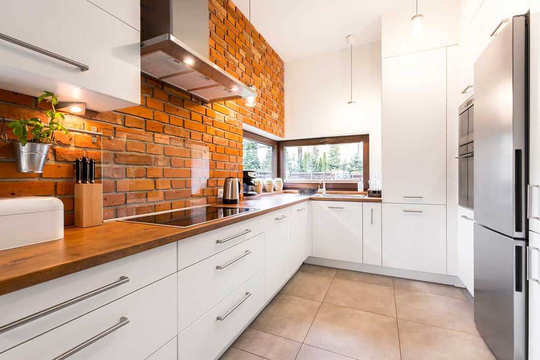 Modern-designed-kitchen-with-brick-wall