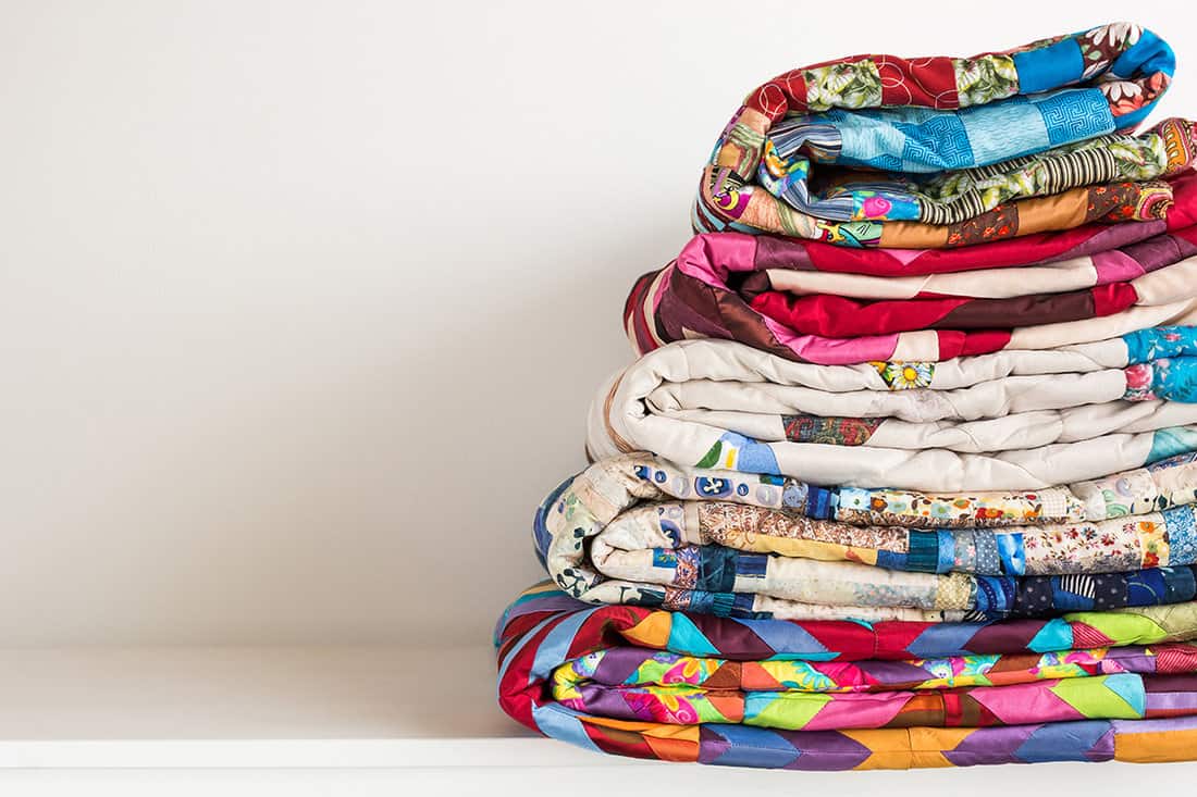 Stack of colorful quilts