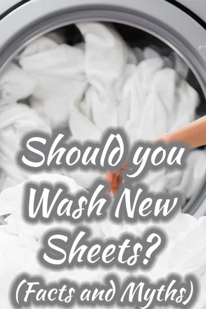A lady showing her hand washing new sheets using a machine, Should You Wash New Sheets? (Facts and Myths)