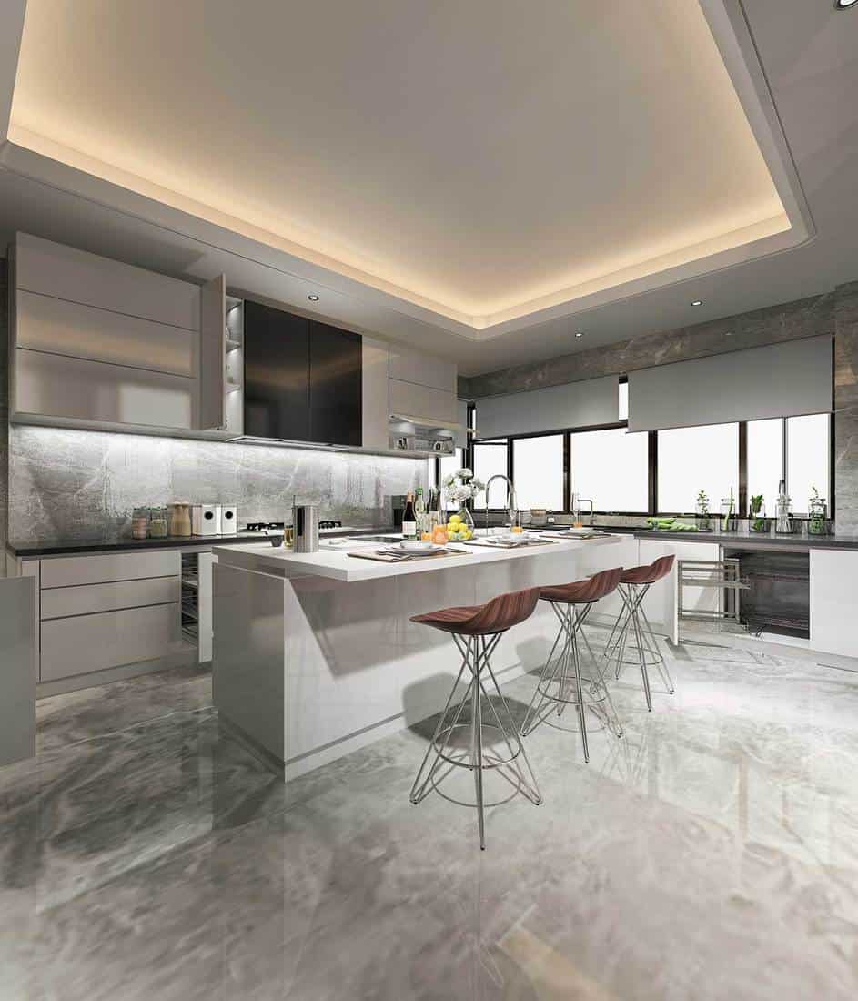 Beautiful modern grey kitchen with dining bar