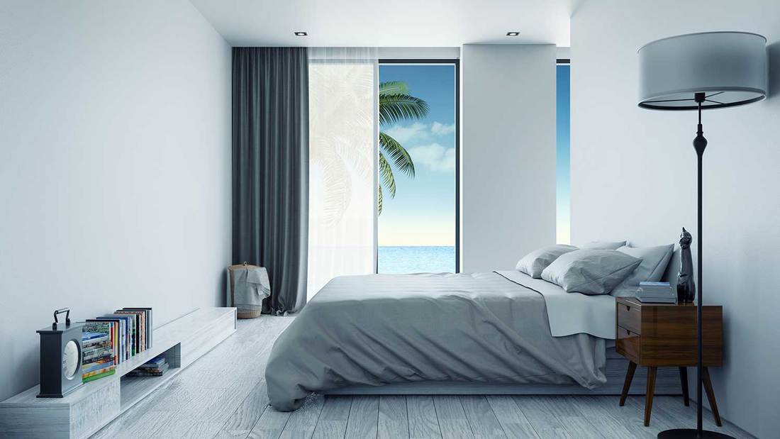 Minimalist interior bedroom design with sea view at villa