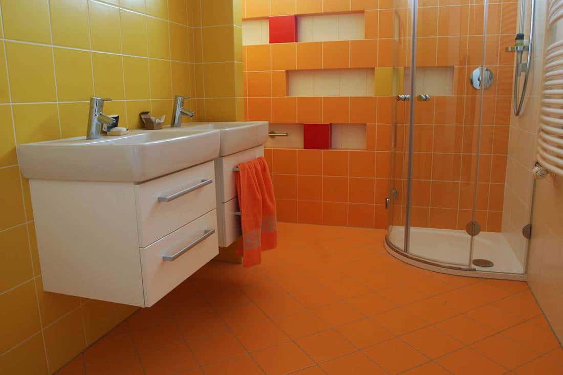 Modern bathroom with tiled walls and floor