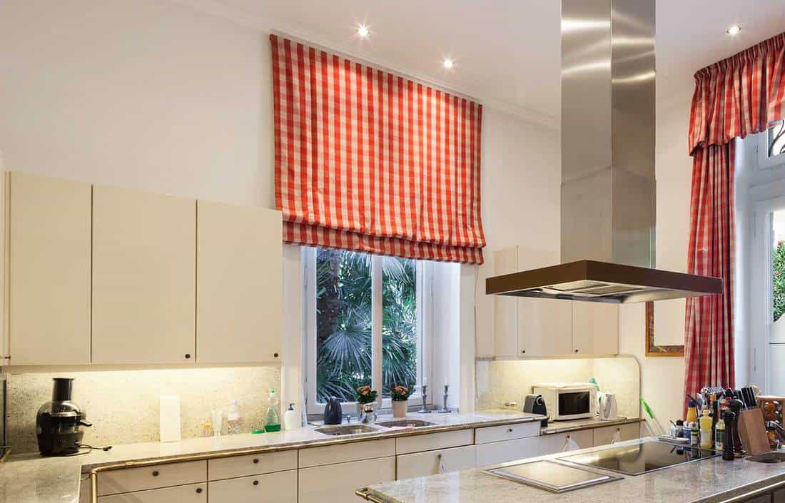Modern kitchen with checkered curtain