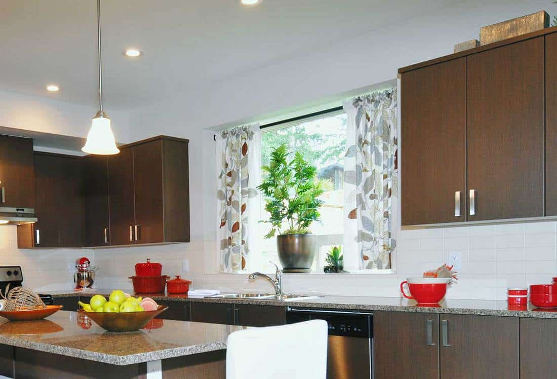 Modern kitchen with nature inspired curtain