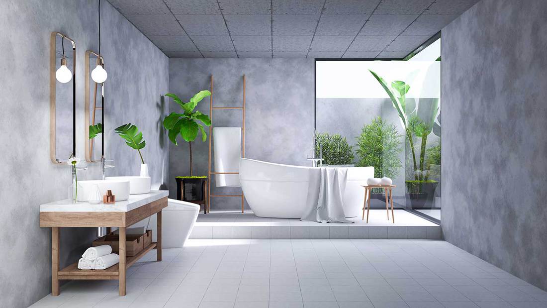 Design d'intérieur de salle de bains loft moderne, baignoire blanche sur une pièce en béton