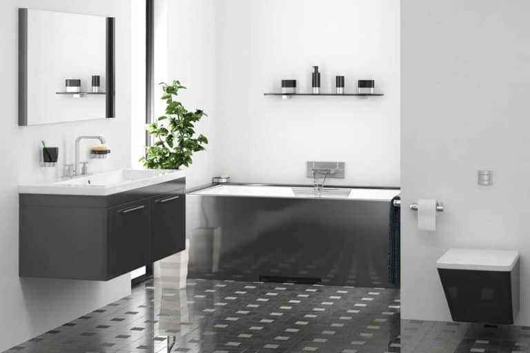 A black and white bathroom interior with matching bath tub and sink, How Much Does a Bath Fitter Tub Cost?