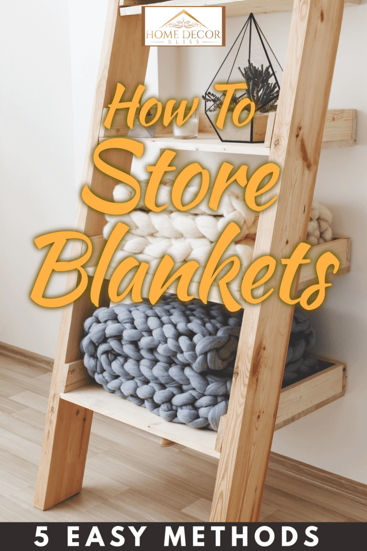 A basket with blankets and pillows near sofa indoors, How to Store Blankets [5 Easy Methods!]
