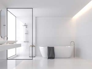 Minimal style white bathroom with large white tile wall and floor