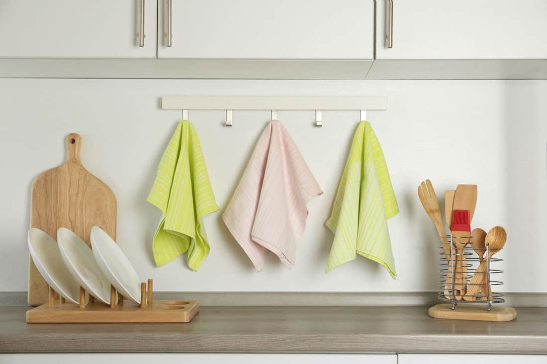 different kitchen towels hanging on hook