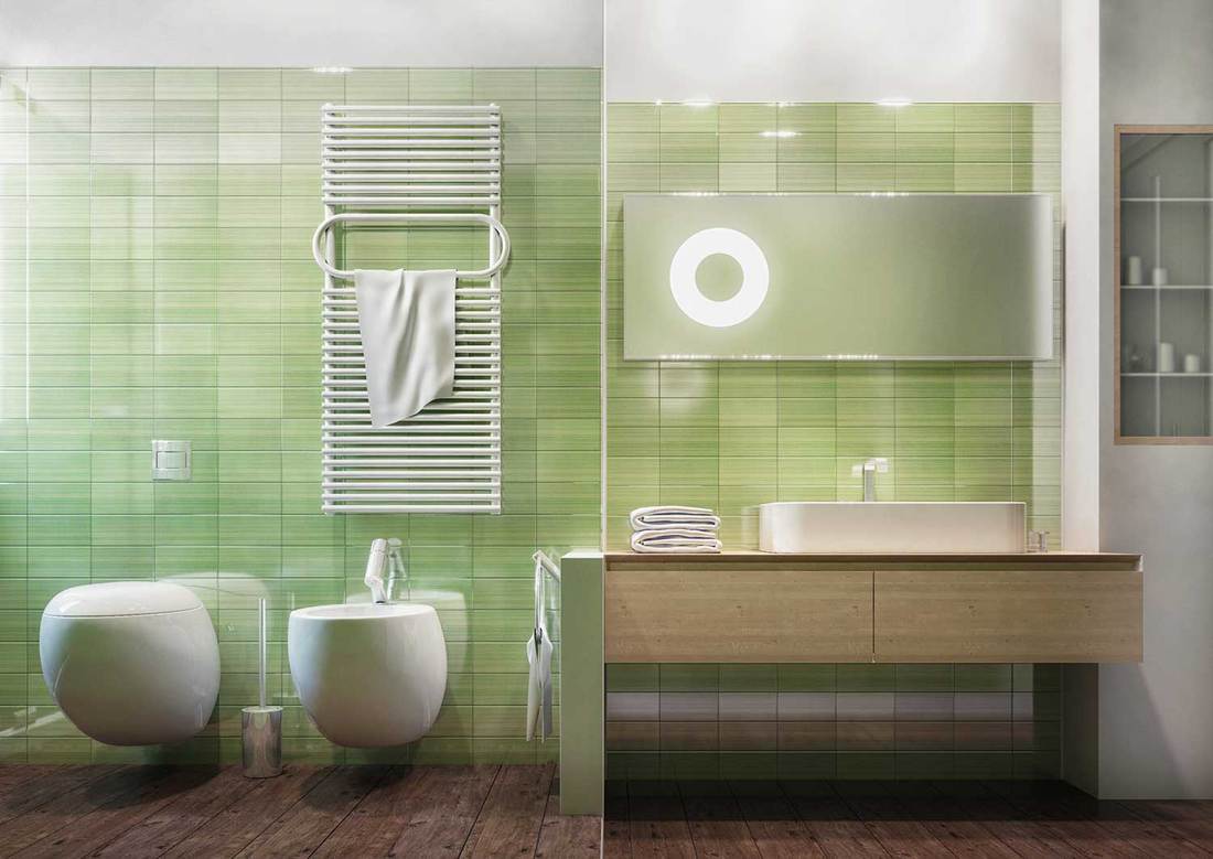 Frontal view of a clean and modern bathroom, green ceramic tiles, wood floor