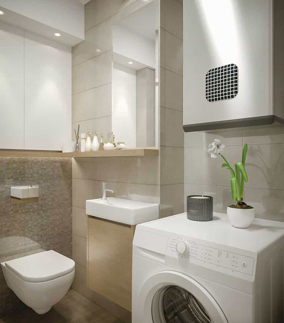 Modern bathroom interior with sink, toilet and washing machine