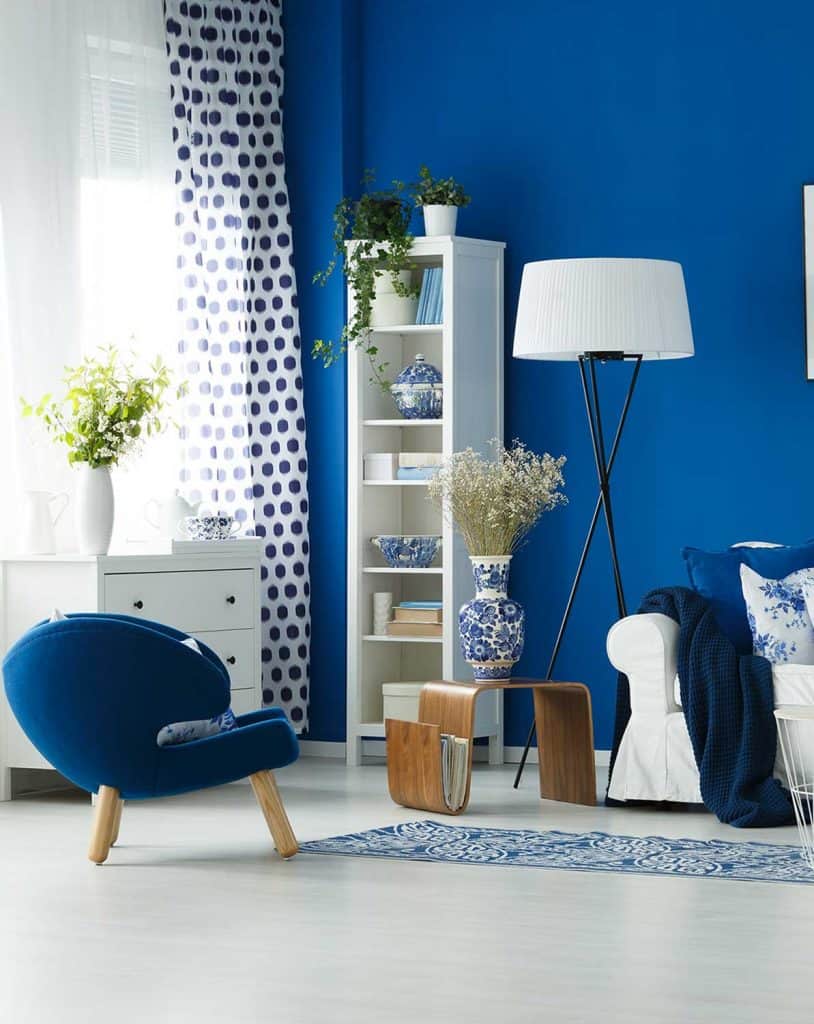 Modern blue and white themed living room with polka dots window curtain