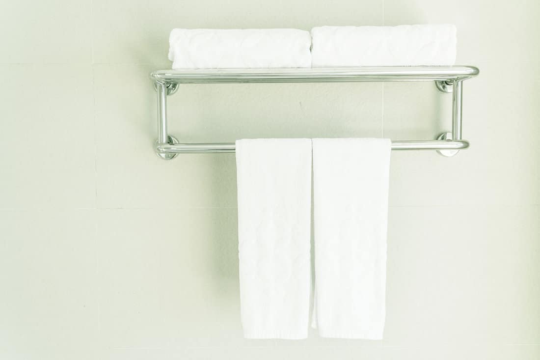 Clean towels hanged on stainless steel towels racks