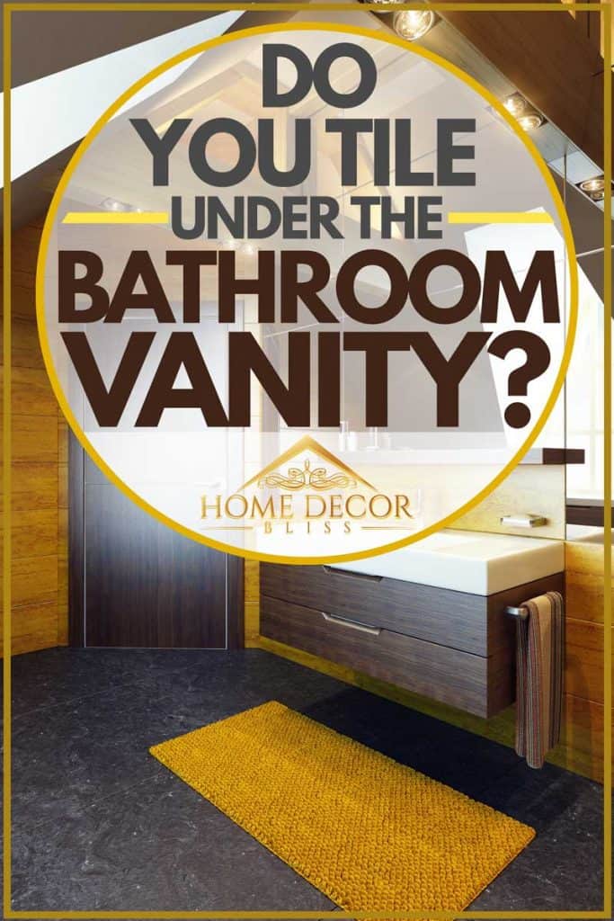 Salle de bain à thème rustique avec murs peints en jaune foncé et vanité marron avec dessus en céramique blanche, Do You Tile Under the Bathroom Vanity ?