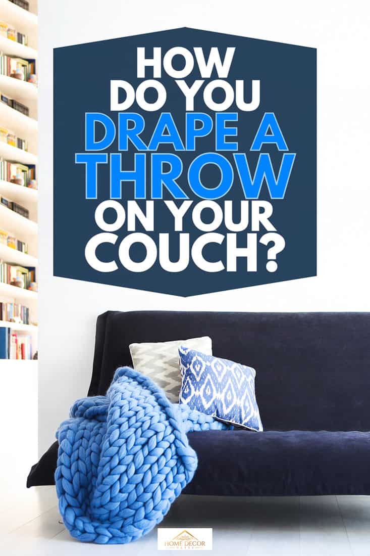 Modern living room interior with sofa and pillows in blue and white, How Do You Drape a Throw on Your Couch?