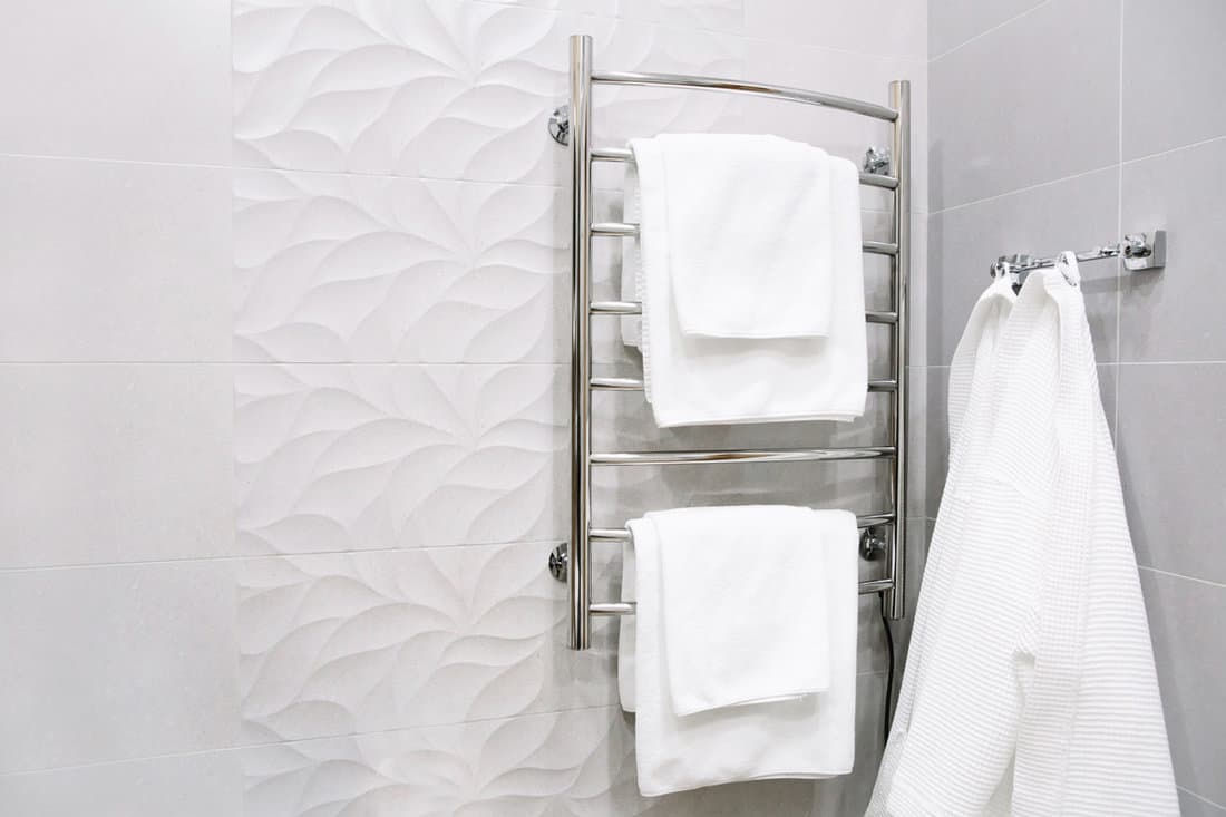 White clean towels hanged on a towel rack