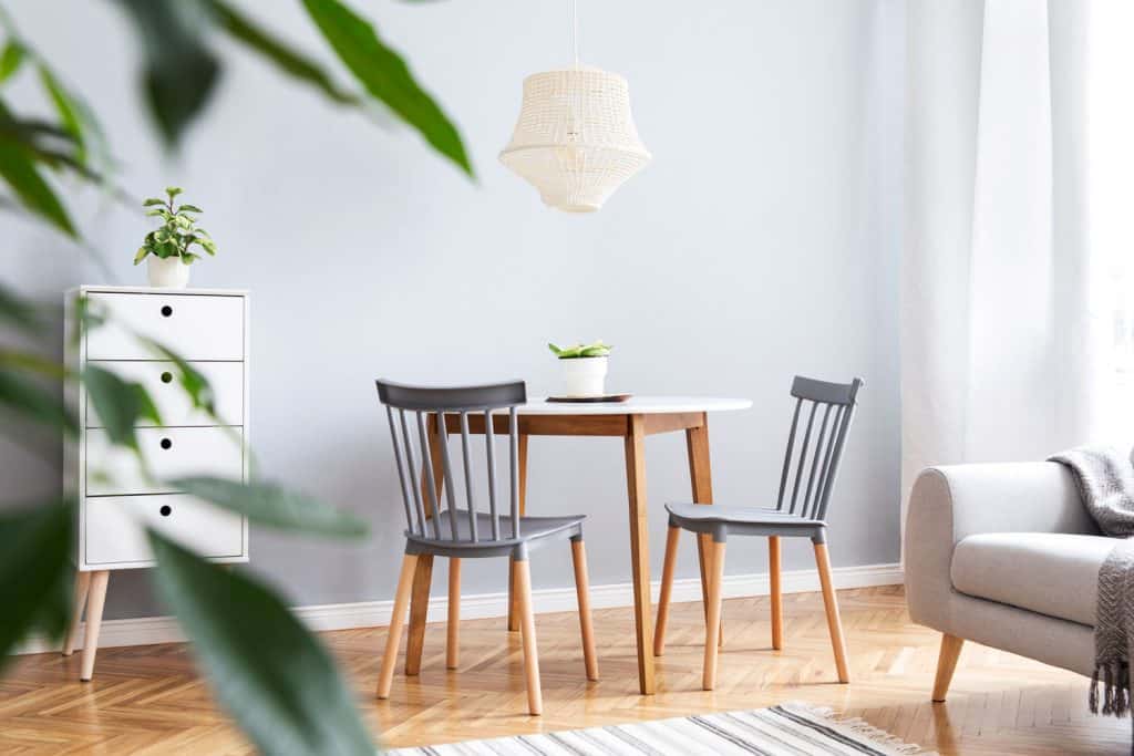 A small two seater dining table inside a minimalist themed dining area