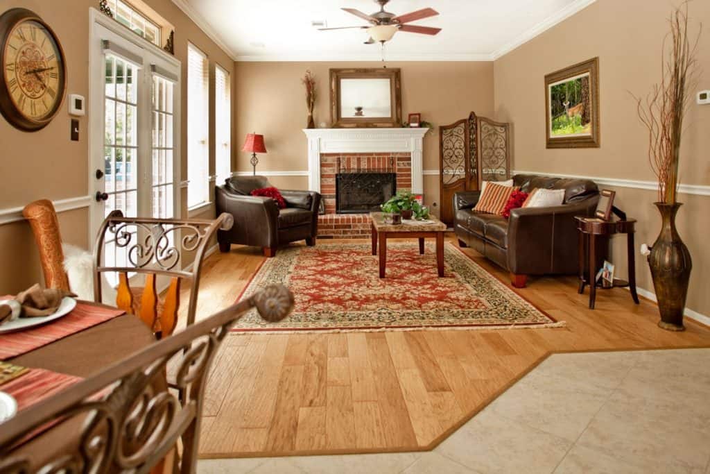 Brown color inspired living room from couches to flooring and fireplace