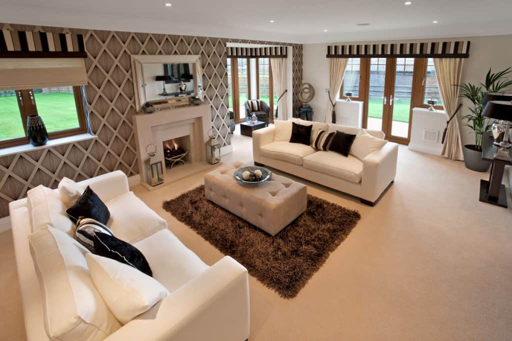 Living room with brown flooring and white ceiling