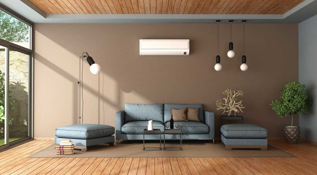 Blue and brown living room with air conditioner, sofa and footstool