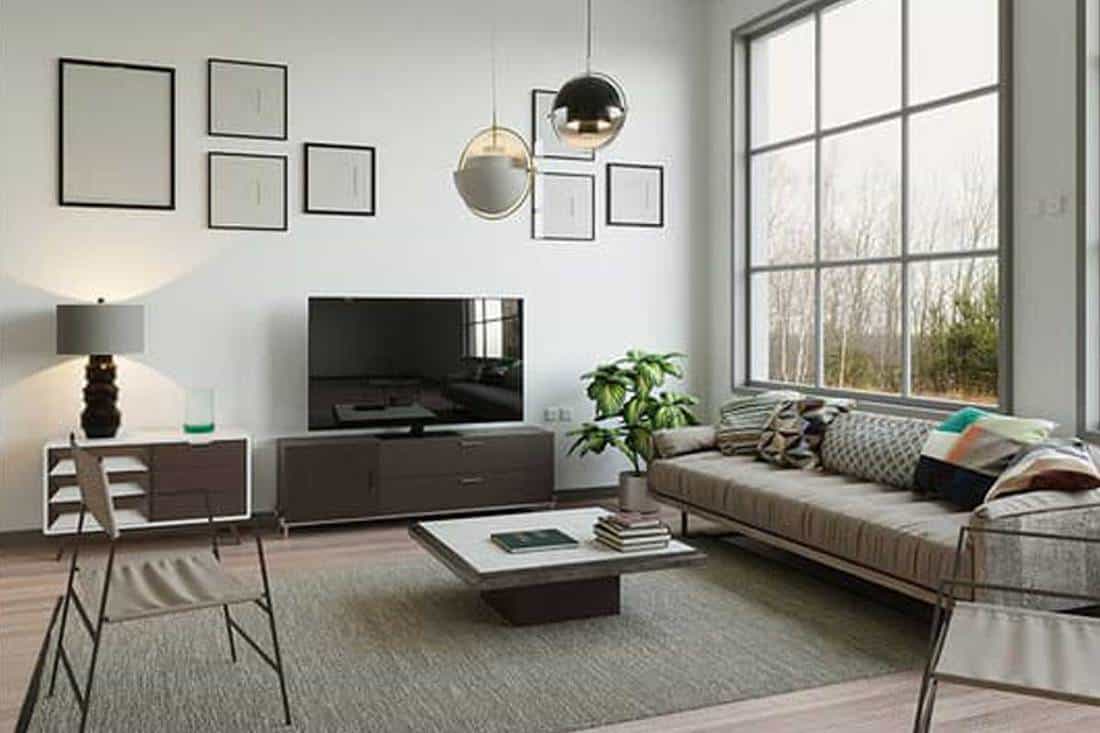 Apartment square living room with wide space, tv, sofa and parquet floor