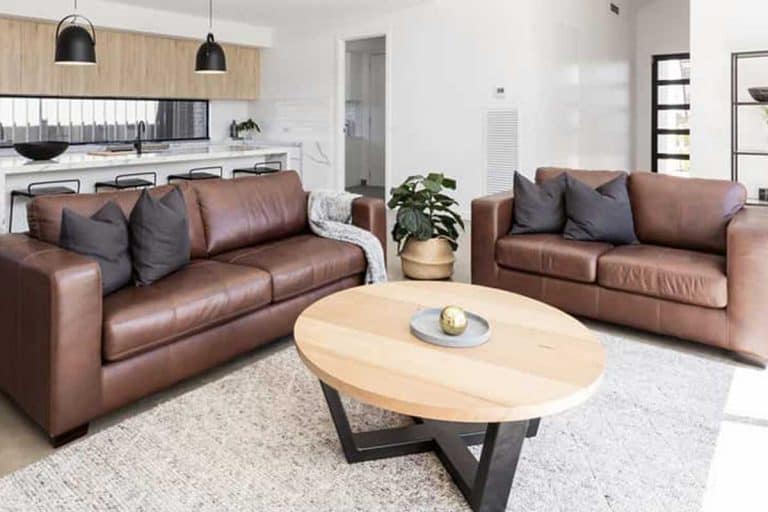 Scandinavian style kitchen and living room with rug and brown leather sofa, What Color of Rug Goes With a Brown Sofa?