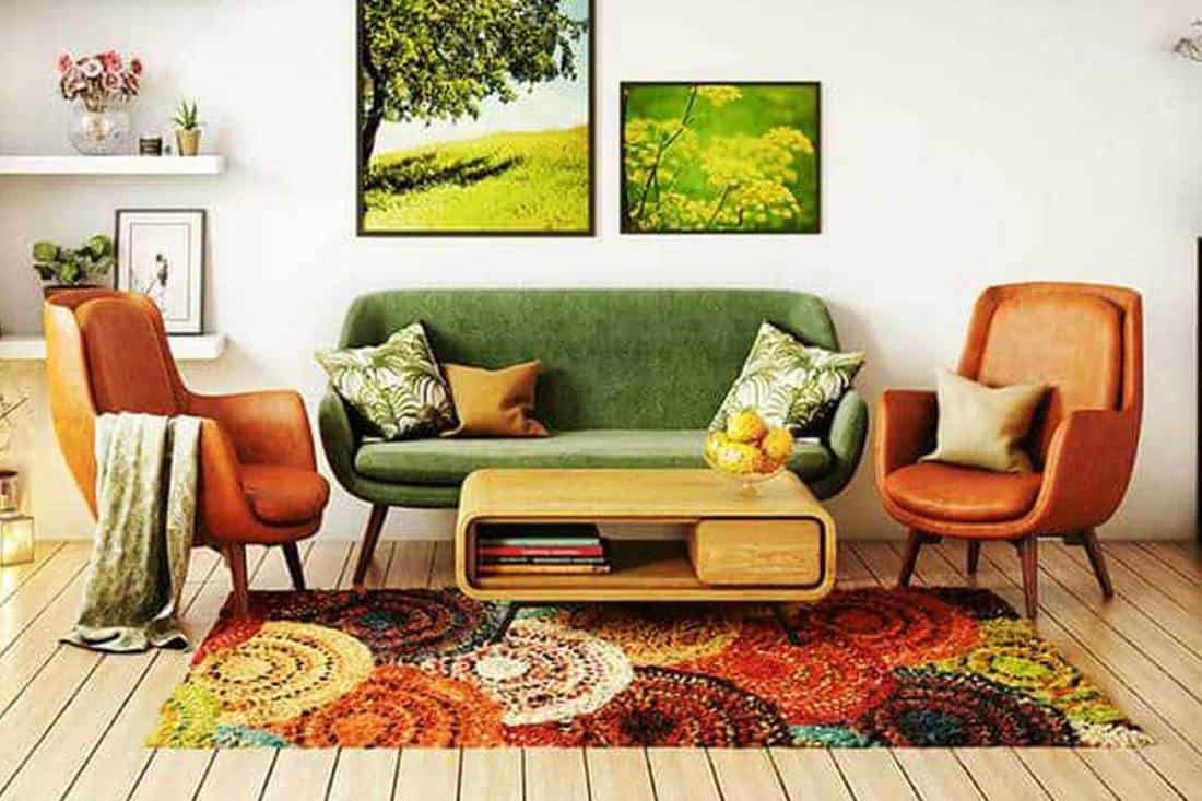 70s style living room interior design with hardwood floor, carpet and green couch, What Goes With A Green Couch [16 Examples to Follow]