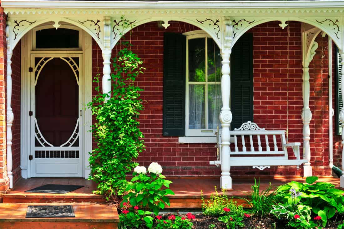Beautiful front porch with arched designed header and brick walls